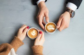 hands and two coffees